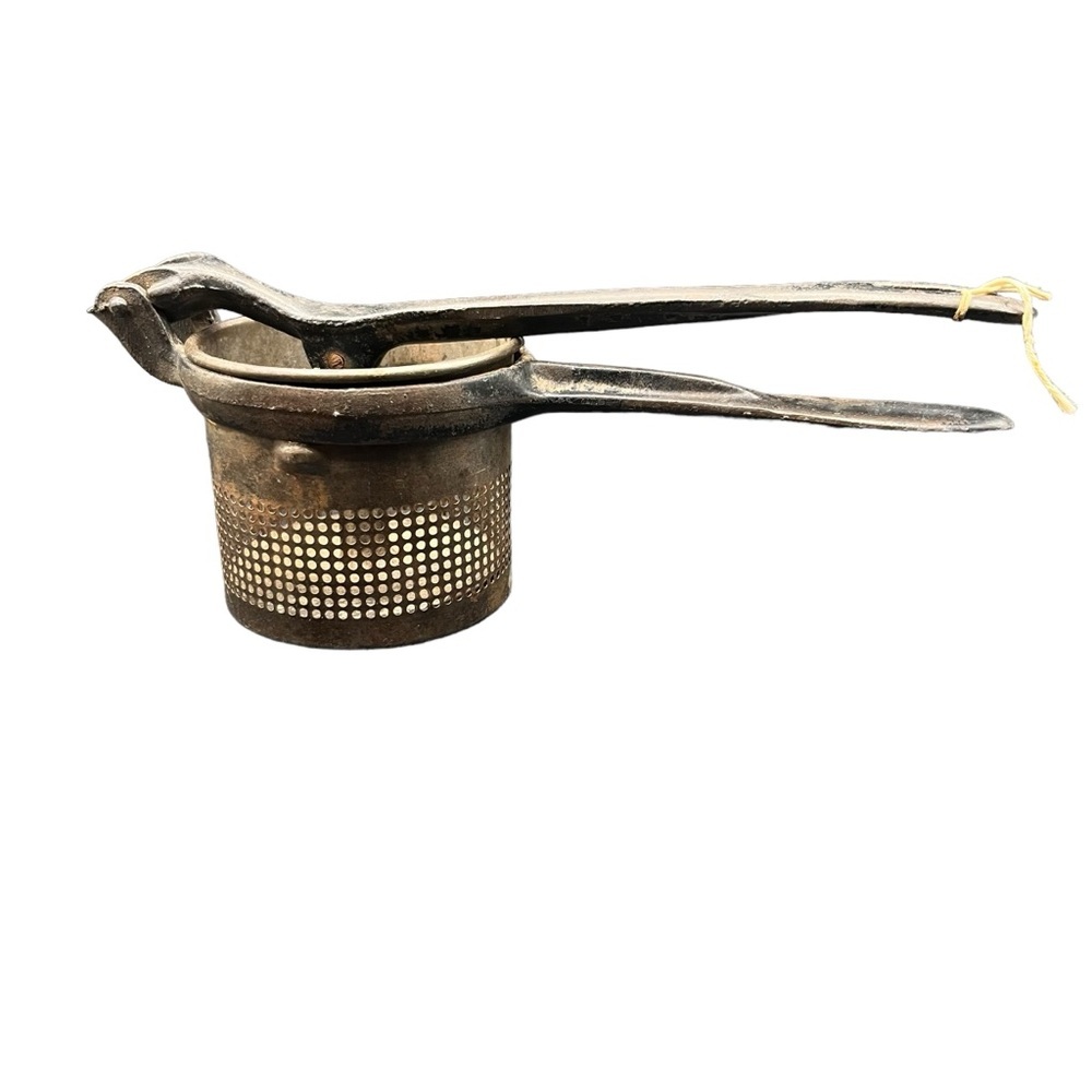 Antique potato press ricer